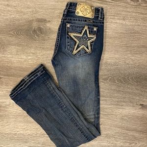 Never worn. Miss Me boot cut jeans size 26! Mid rise